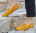 Made from premium yellow color suede leather, these barefoot penny loafers offer a soft, breathable feel and a sophisticated aesthetic suitable for both casual and smart-casual wear.