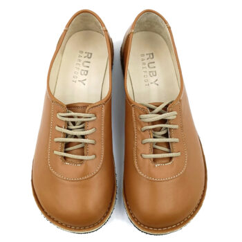 Tan color handmade sneakers.
